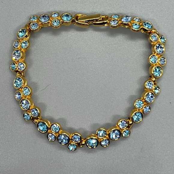Swarovski Jewelry - Swarovski  Blue Crystals Gold Tone Bracelet  Signed Retired 7"